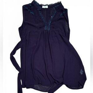 Sheer ruffled sleeveless blouse